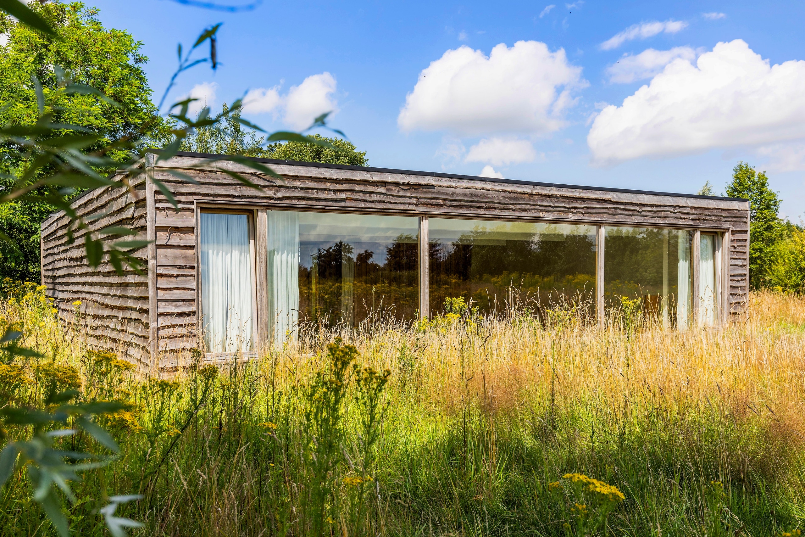 Main temple with its panoramic glass (sunrise with gate and fence)