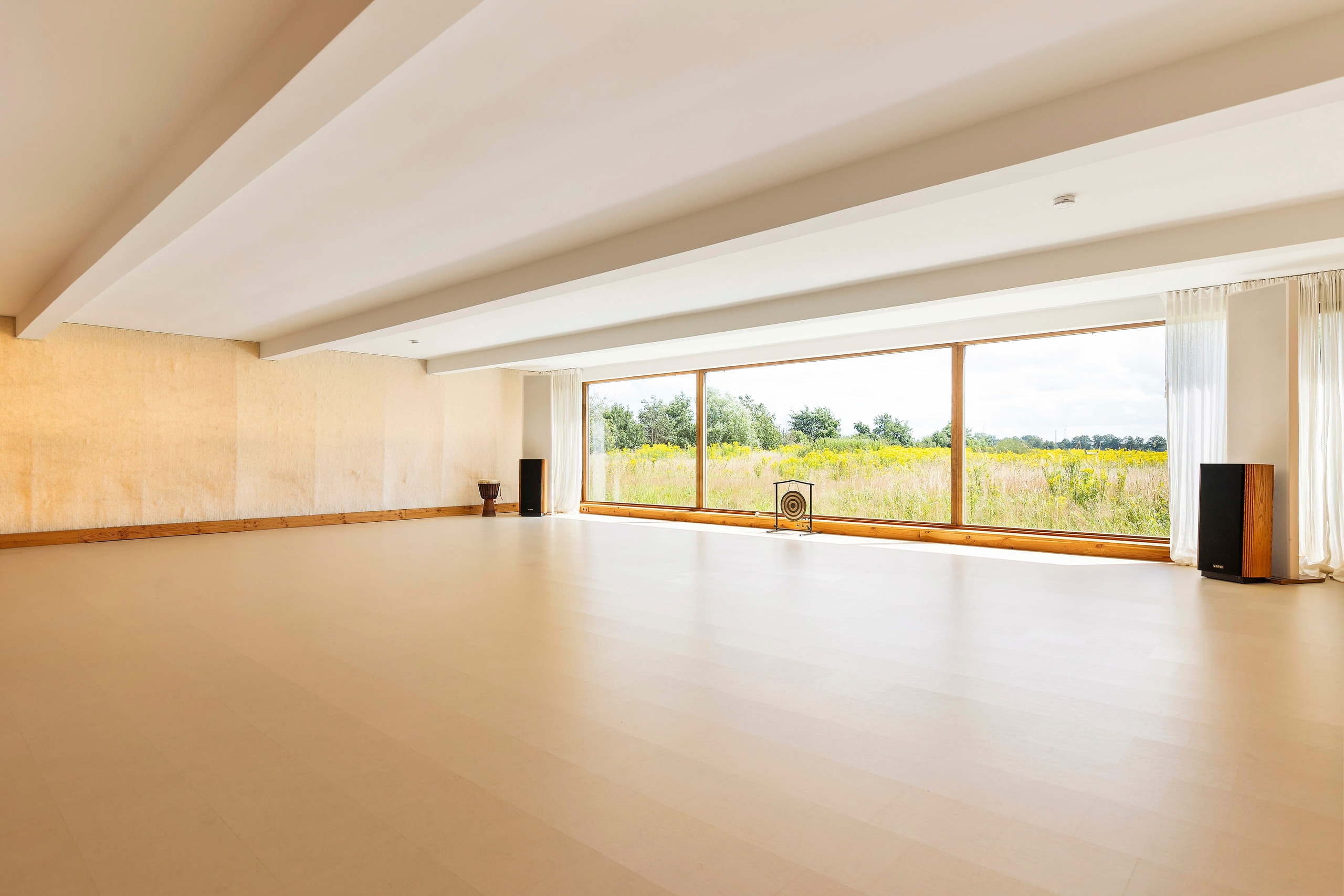 Main temple with its panoramic glass (morning meadow with a red-leaved tree)