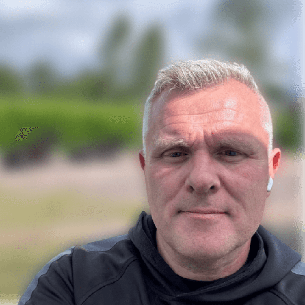 framer-legacy-about-team-bart framer-legacy-about-team-bart: cutout portrait of a smiling man holding a small dog