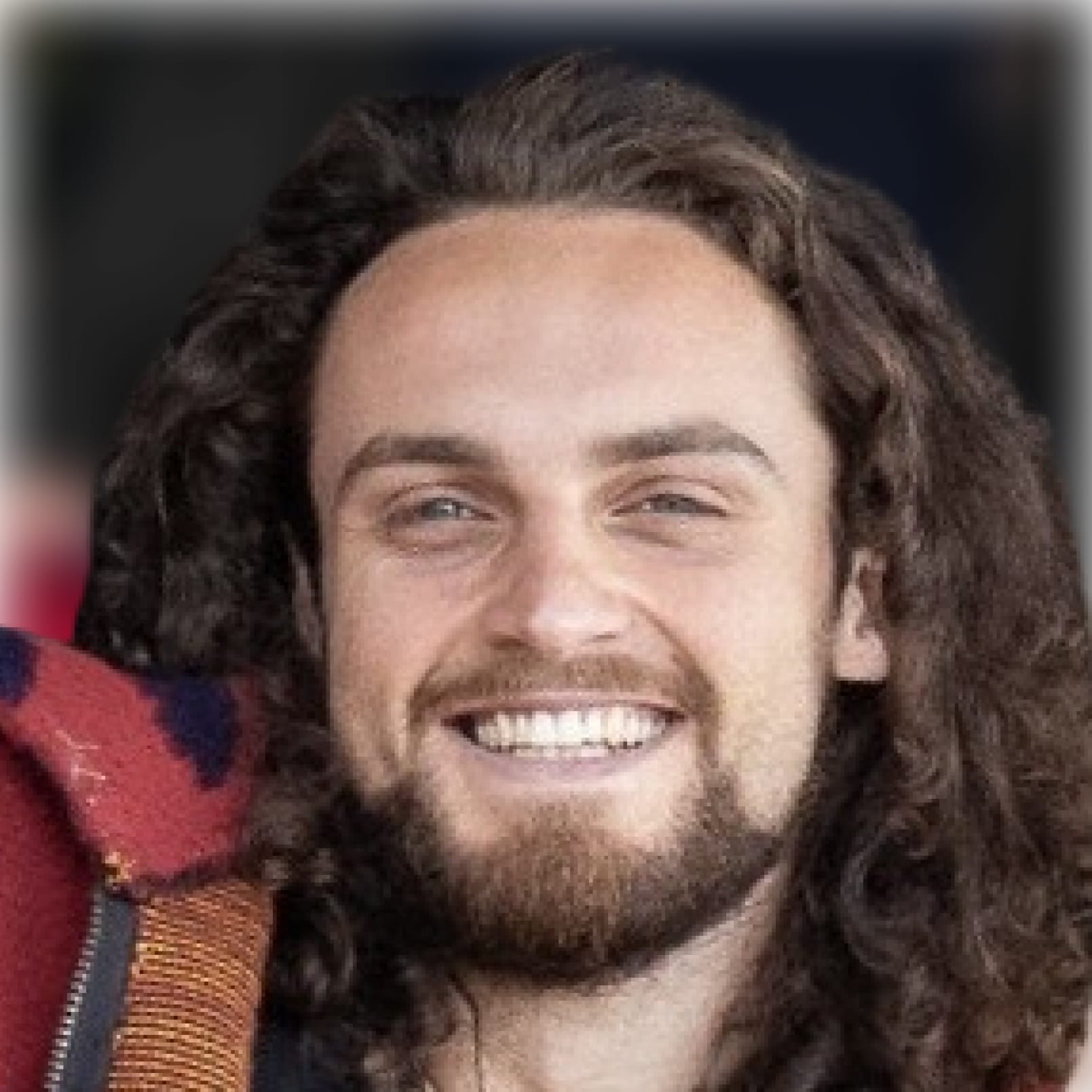 about-team-max Max: portrait of a smiling man with curly hair